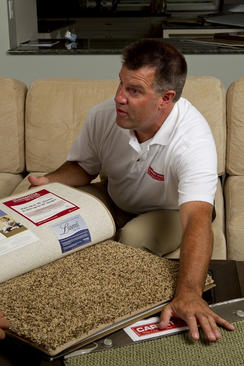 sales rep with carpet samples